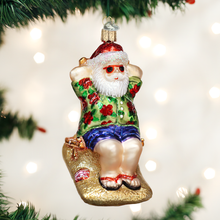 Load image into Gallery viewer, Sunning Santa Ornament
